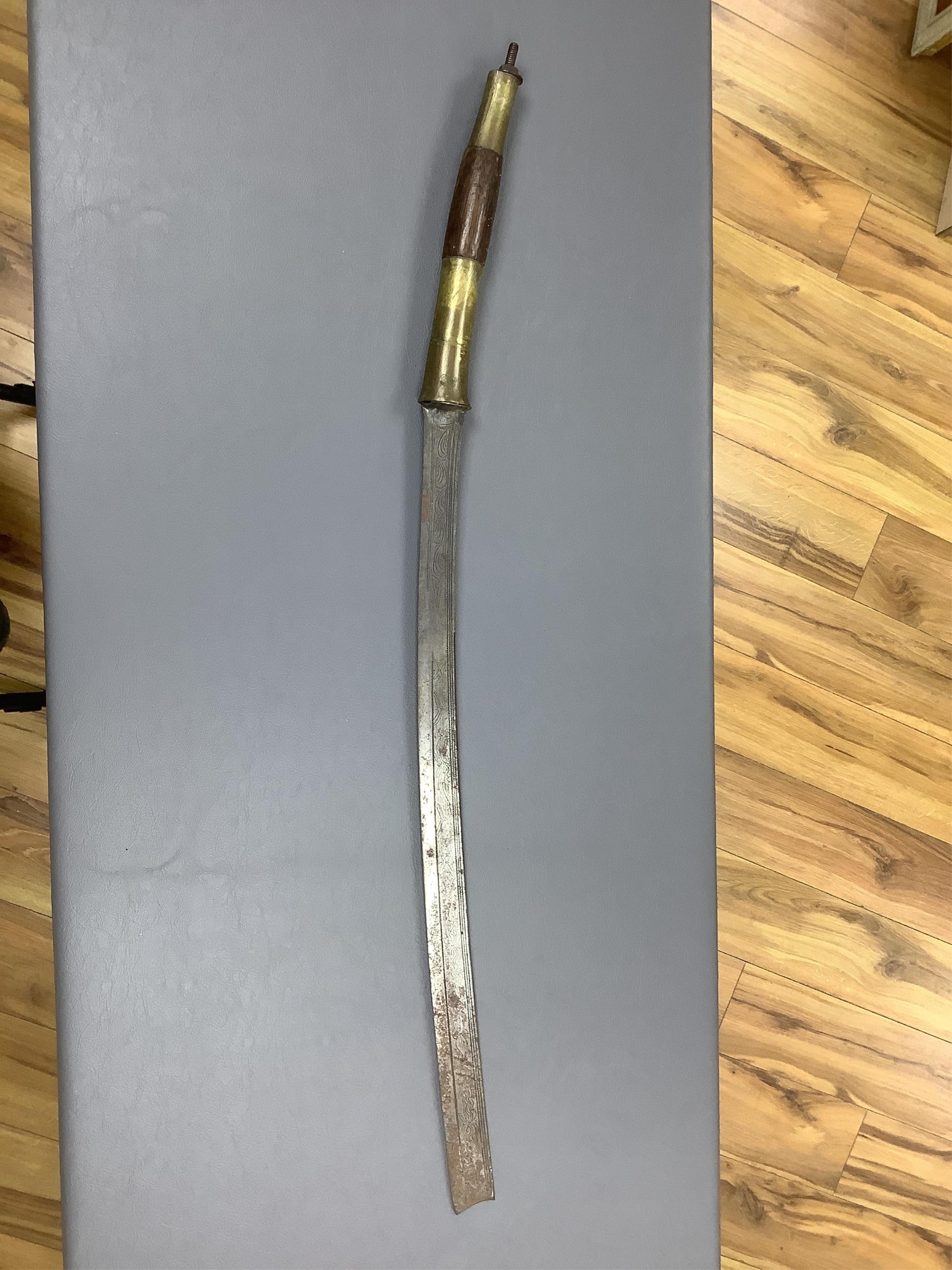 Eighteen assorted world weapons comprising a silver jambya (pommel missing), a knobkerry, a dha, two kris (one with handle missing), a lohar, three kukris, a djambok, a Chinese trousse, a chora, a flyssa, five others and